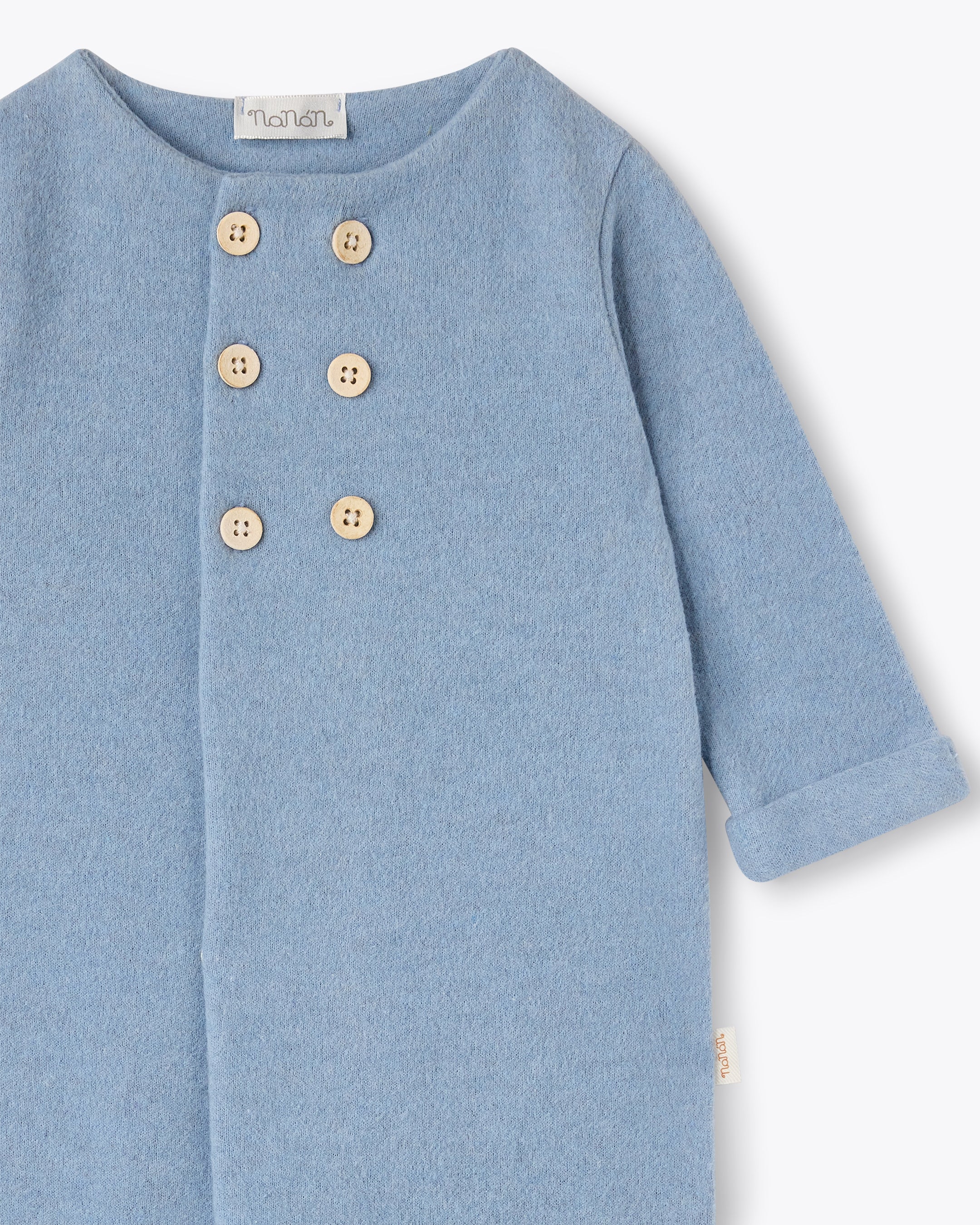 Tutina azzurra con apertura doppi bottoni